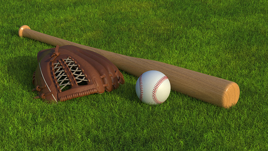 Baseball glove, bat, and ball, on grass. Baseball equipment in the field. Close-up view of baseball equipment.