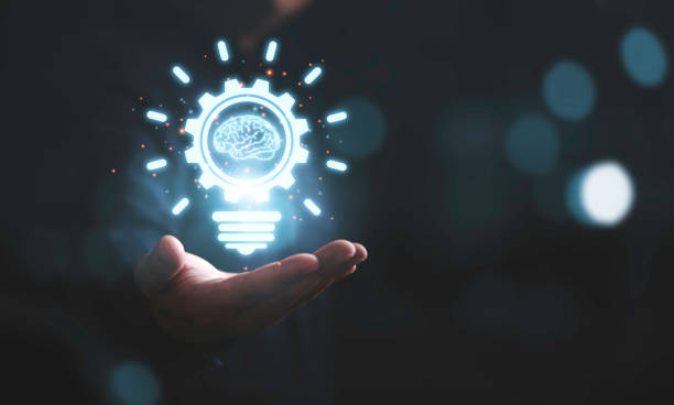 istock Businessman holding glowing drawing lightbulb with virtual brain and connection line, creative thinking ideas and innovation concept. 1410090464
