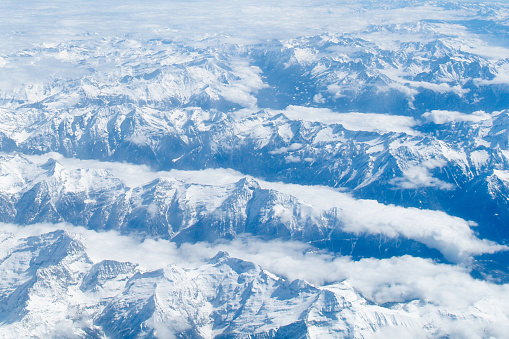 An aerial photograph of the Swiss Alps mountain range.