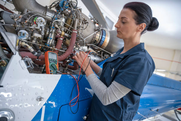 istock Female mechanic repairing helicopter engine 1410092849