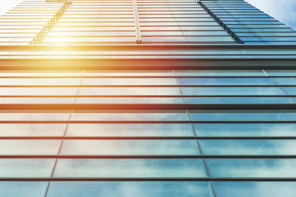 istock underside panoramic and perspective view to steel blue glass high rise building skyscrapers, business concept of successful industrial architecture 1410094209
