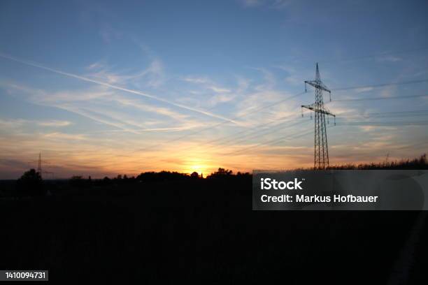 Sunset With Powerpole Stock Photo - Download Image Now - Color Image, Electricity Pylon, Germany