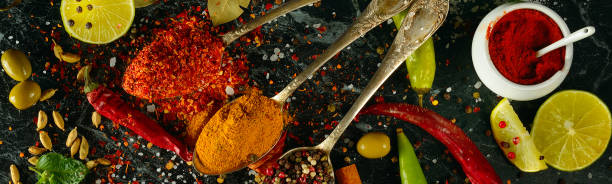 istock Many different spices and aromatic herbs on a dark. View from above. Wide photo. 1410095351