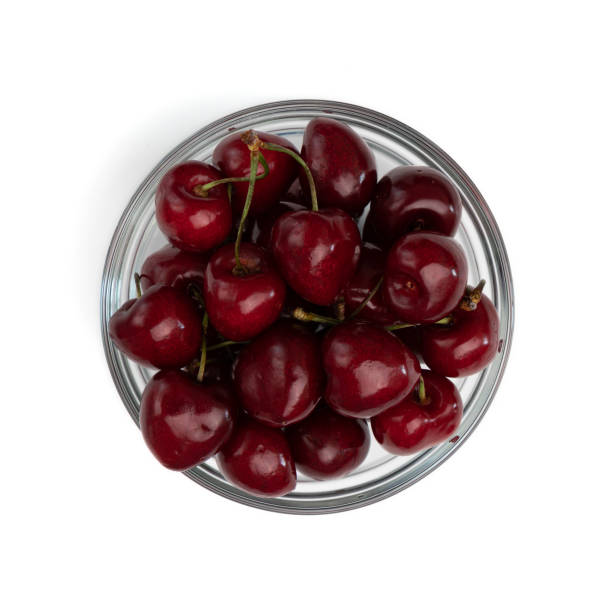 istock cherries in glass bowl isolated on white 1410095403