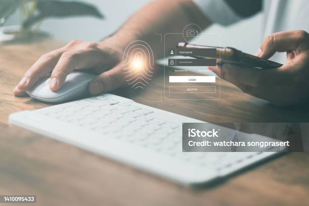 Cyber Security Concept Mans Hand Using A Smartphone Log In To Applications Via Fingerprint Scanning It Is The Security Of The Information Stock Photo - Download Image Now