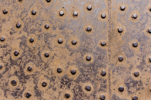 Ship Metal Plate Rivets Old ship deck metal plate rivets detail background decor of era in ocean transport.