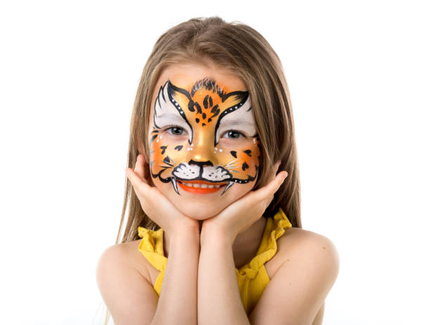 istock cute little girl with painted face 1410098957
