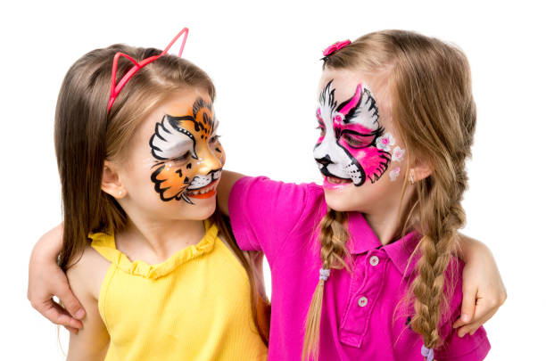 istock two little girls with painted faces 1410098978