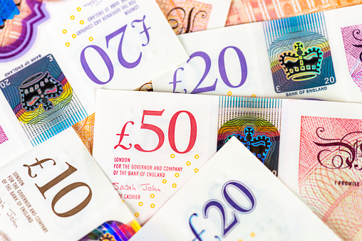 Close-up with selected focus of Swedish banknotes on white background.