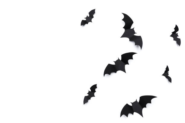 istock halloween and decoration concept - paper bats flying 1410103060