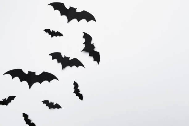 istock halloween and decoration concept - paper bats flying 1410103942