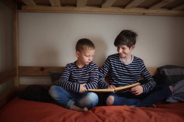 istock The brothers read together on two bunk beds 1410105538