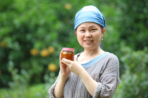 Woman with handmade jam