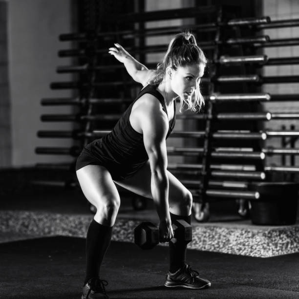 istock Cross training. Young woman exercising at the gym 1410106068