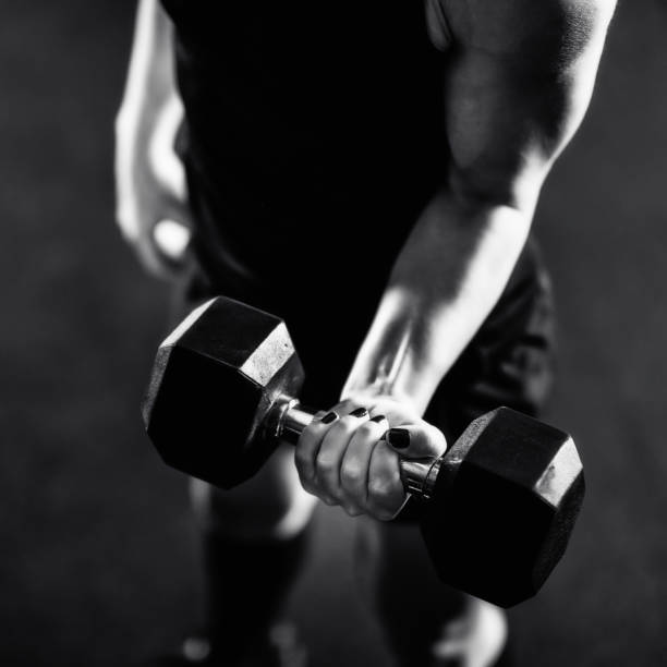 istock Cross training. Young woman exercising at the gym 1410106150
