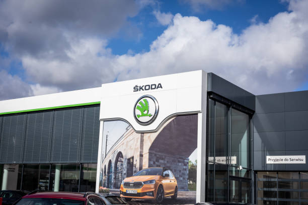 Skoda Auto dealership company building. Wroclaw, Poland - February 19, 2022: Company store building with an emblem of Skoda Auto, Czech automobile manufacturer. No people, cloudy sky. former czechoslovakia stock pictures, royalty-free photos & images