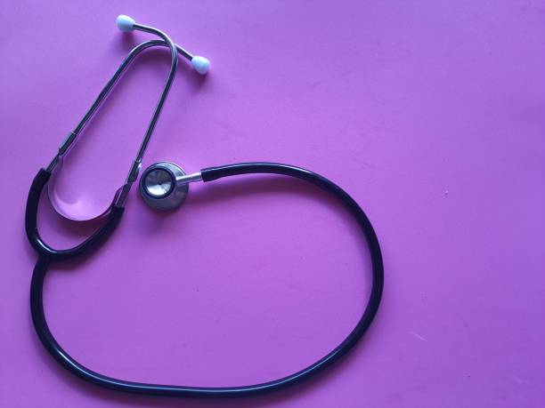istock Stethoscope, isolated on a pink background, top view. 1410113800