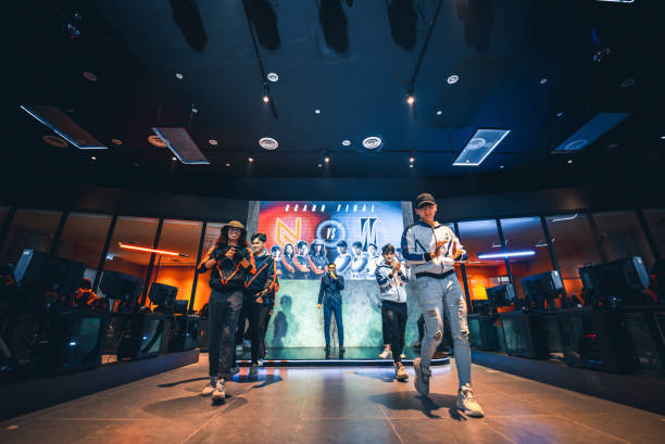istock Asian Emcee Game show host introducing grand final esports team players on stage 1410113876