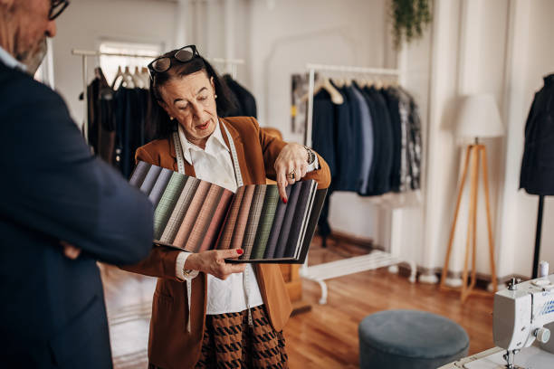 istock Saleswoman and customer design for suit 1410114062