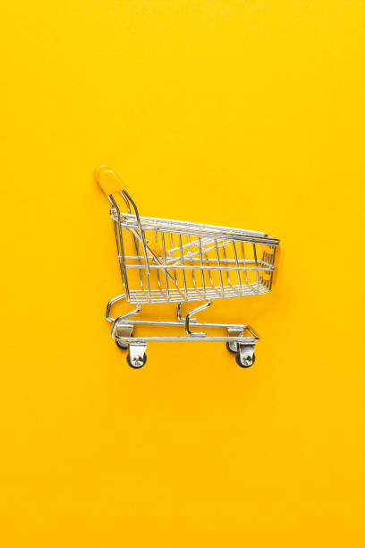 istock shopping trolley on yellow background 1410115637