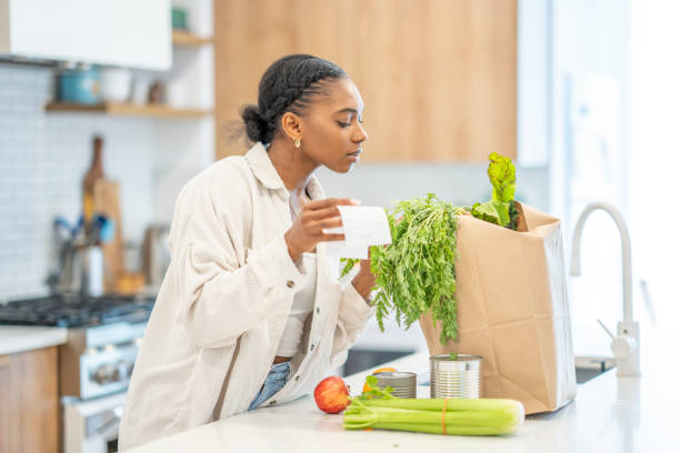 istock Woman Puzzled Reviewing Her Grocery Bill 1410116163