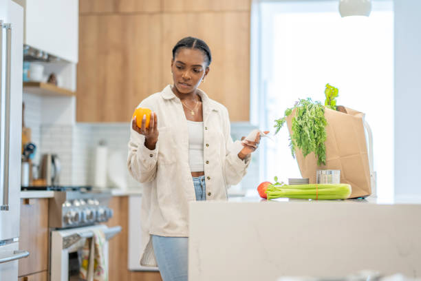 istock Woman Puzzled Reviewing Her Grocery Bill 1410116175