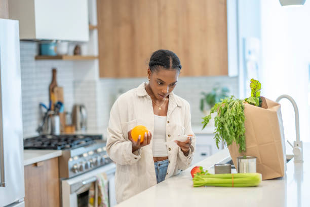 istock Woman Puzzled Reviewing Her Grocery Bill 1410116207