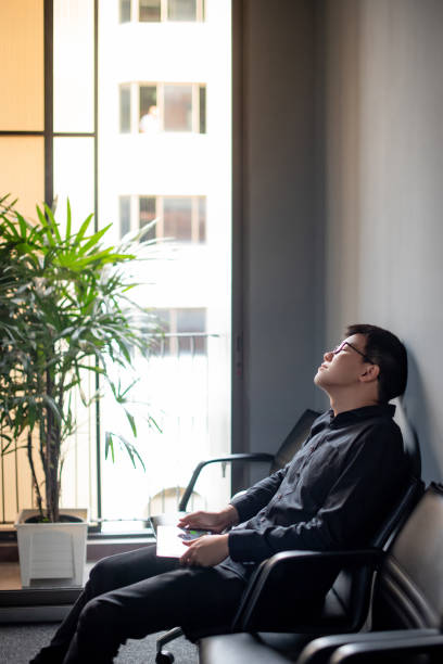 istock Asian Businessman feeling stressed in meeting room 1410116241