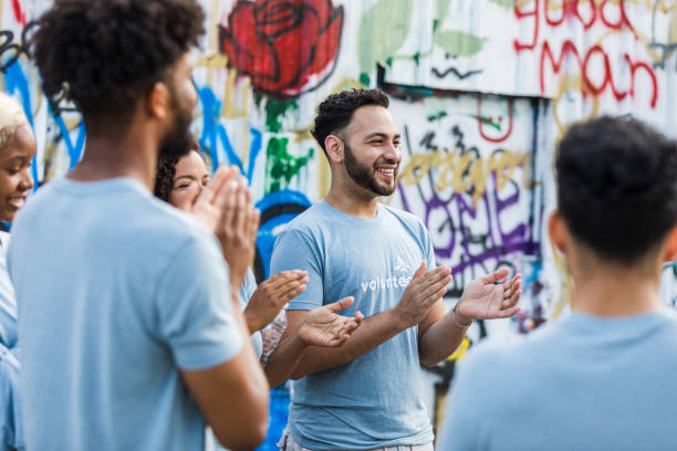 istock Volunteers cheer for each other 1410117415