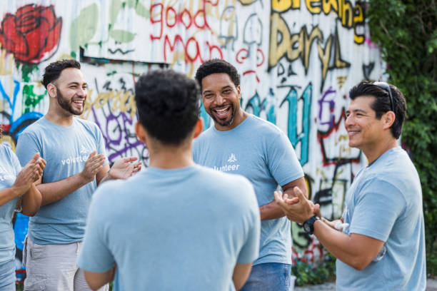 istock Group of volunteers smile and talk 1410117428
