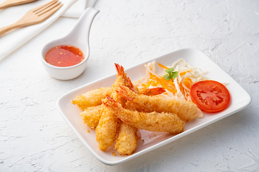 Crispy fried shrimp.Deep fry shrimp with Breadcrumbs on white plate with chilli sweet sauce