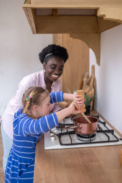 istock A woman and a girl looking busy while doing some housework 1410123163