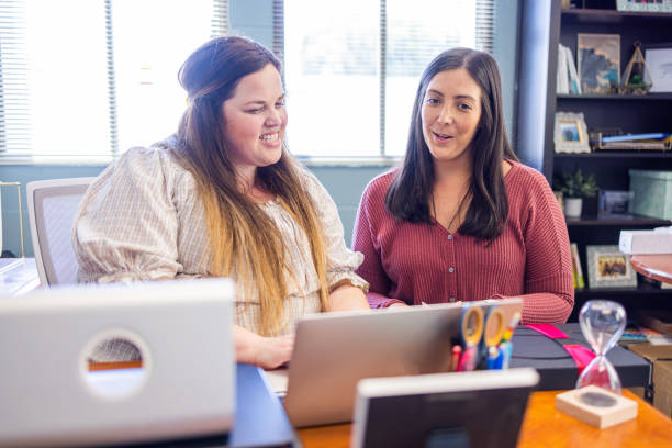 istock Female Business Colleagues Working Together 1410123850