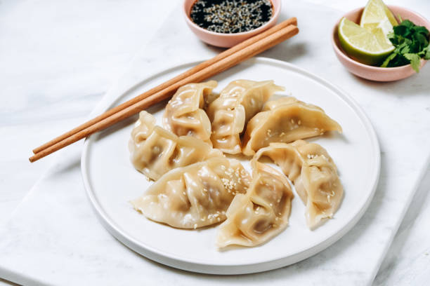 istock gyoza dumplings  on a white plate with soy sauce 1410124160