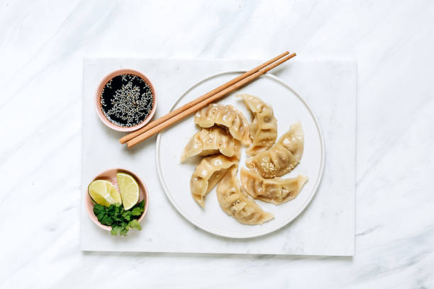 istock gyoza dumplings  on a white plate with soy sauce 1410124218