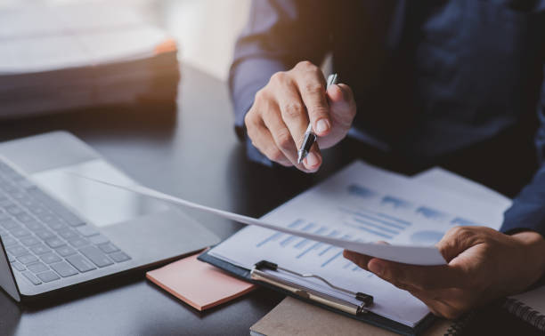 istock legal Business advisor  working at office with documents on his desk, doing planning analyzing the financial report, business plan investment, finance analysis concept 1410125331