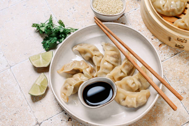istock gyoza dumplings  on a white plate with soy sauce 1410125370