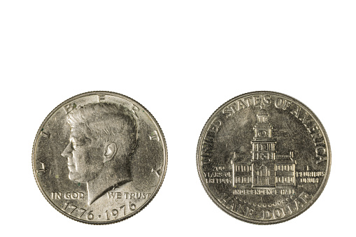 Close up view of front and back side of half USA dollar coin dated 1776-1976. Numismatic concept.