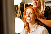 Smiling woman at hairdresser