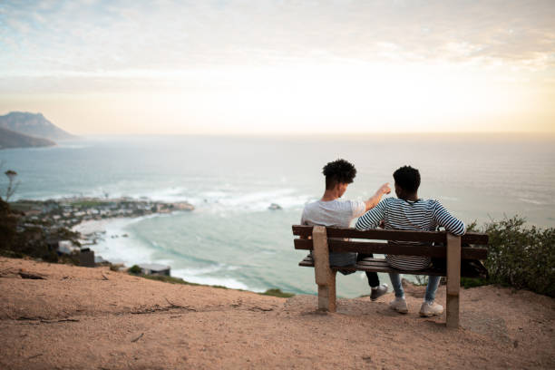 Friends sitting on the bench and talking