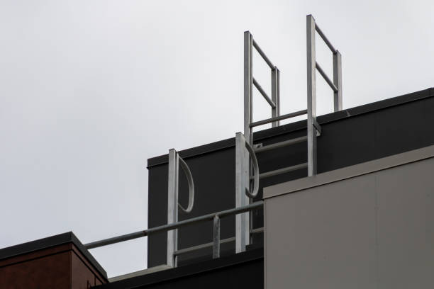 black grey building with metal ladder. stock photo