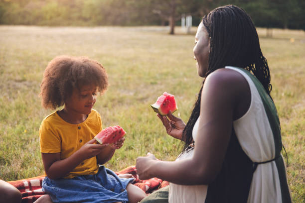istock Multiracial family going for a picnic in a public park 1410134003