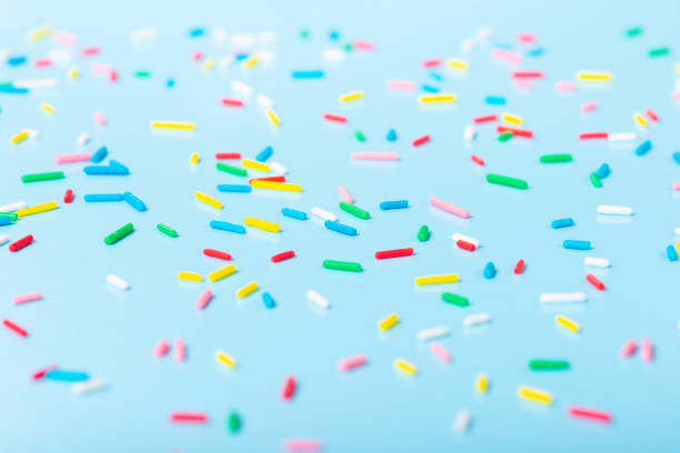 istock colorful sprinkles over blue background, decoration 1410134125