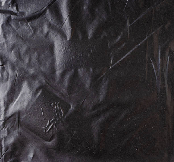 istock Abstract background made of black plastic film 1410134602