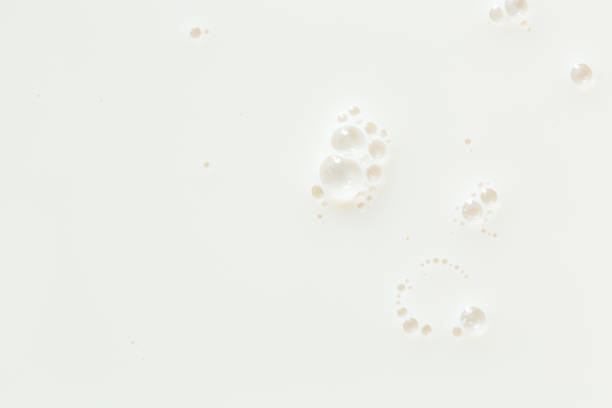 istock Macro milk,White surface of milk and bubbles and ripples from above birds eye view,Bubbles on milk surface 1410136731