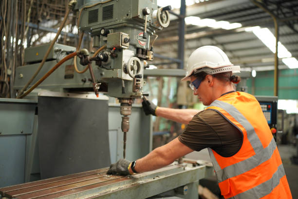 istock industrial background of caucasian mechanics engineer operating lathe machine for metalwork in metal work factory 1410137212