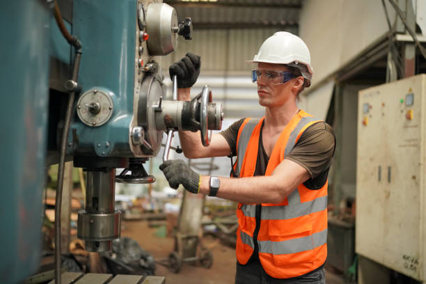 istock industrial background of caucasian mechanics engineer operating lathe machine for metalwork in metal work factory 1410137262