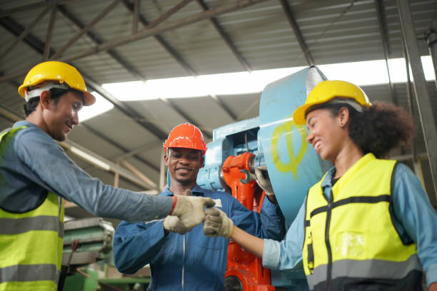 istock Three Diverse Multicultural Heavy Industry Engineers and Workers in Uniform at Steel Factory. 1410137823
