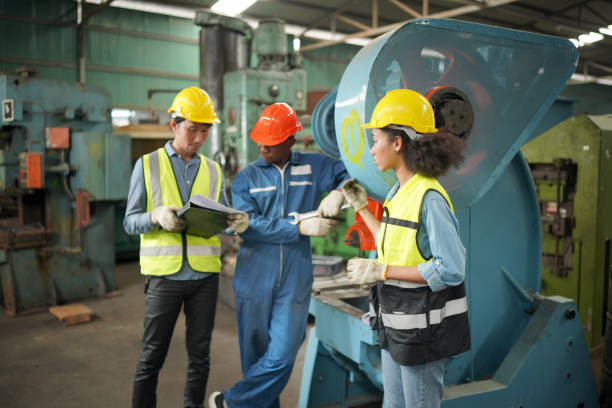 istock Three Diverse Multicultural Heavy Industry Engineers and Workers in Uniform at Steel Factory. 1410137904