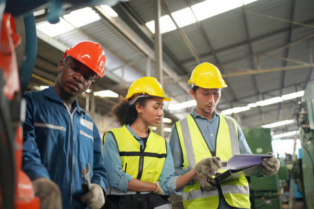 istock Three Diverse Multicultural Heavy Industry Engineers and Workers in Uniform at Steel Factory. 1410137913